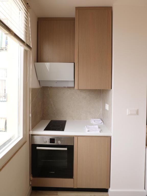 Kuchyň nebo kuchyňský kout v ubytování Tola Apartaments
