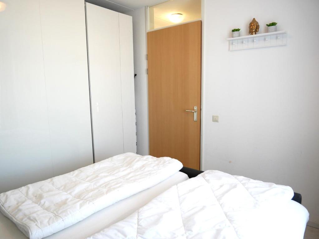 Postel nebo postele na pokoji v ubytování Badhotel Callantsoog