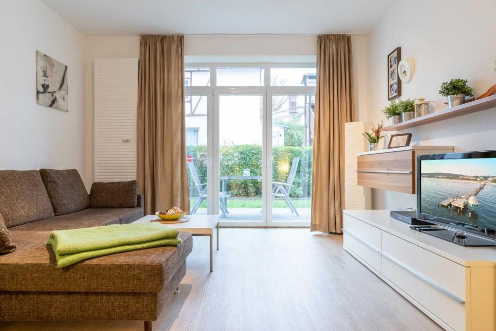 Un televizor și/sau centru de divertisment la Villa Marin Wohnung 05
