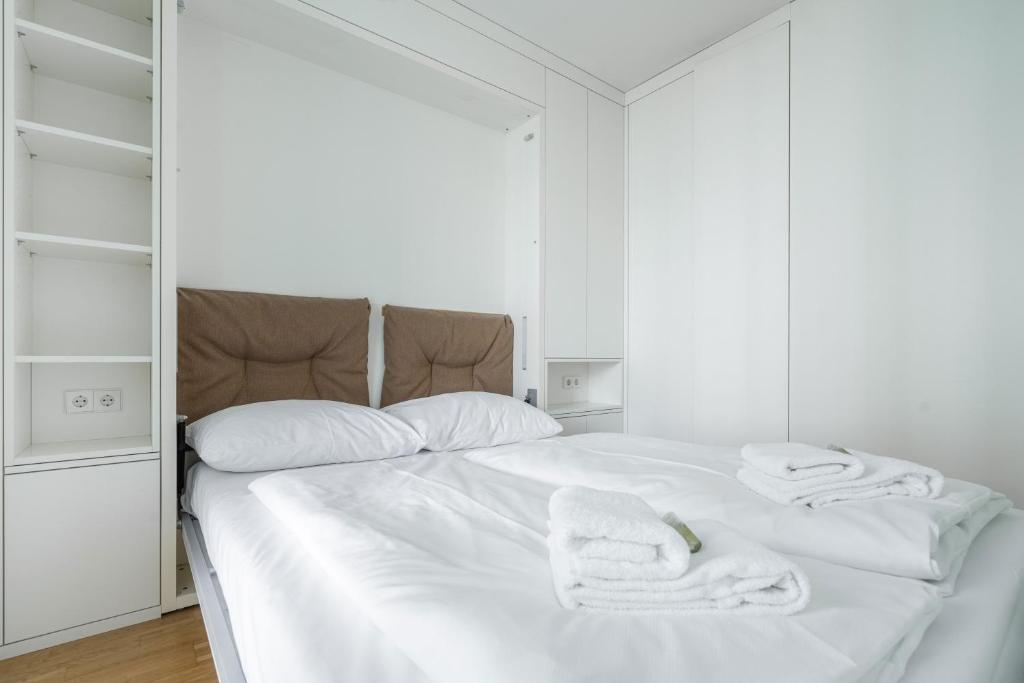 Łóżko lub łóżka w pokoju w obiekcie easy flat Green Prater
