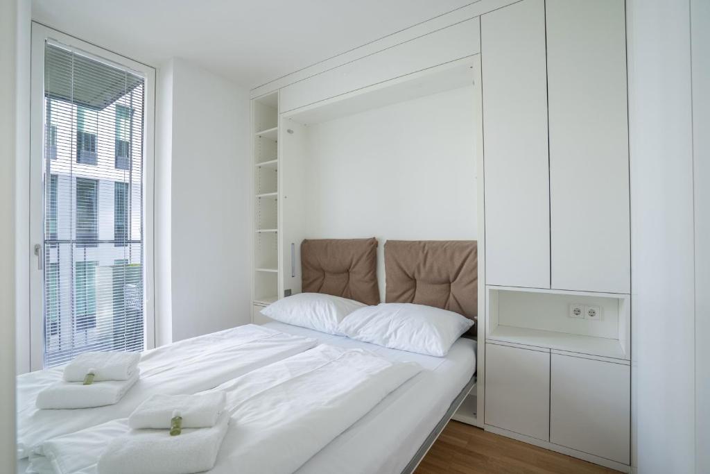 Łóżko lub łóżka w pokoju w obiekcie easy flat Green Prater