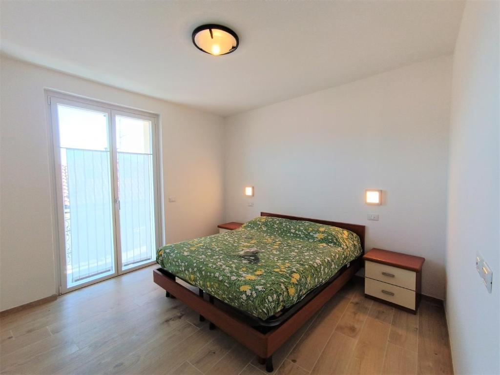 A bed or beds in a room at Appartamento Lella