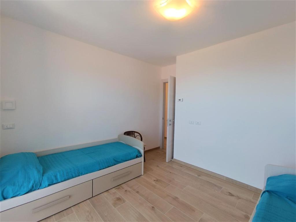 A bed or beds in a room at Appartamento Lella