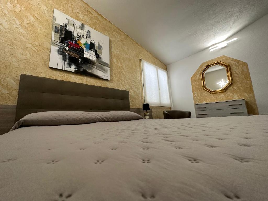 Postel nebo postele na pokoji v ubytování LXR Rooms Carloforte