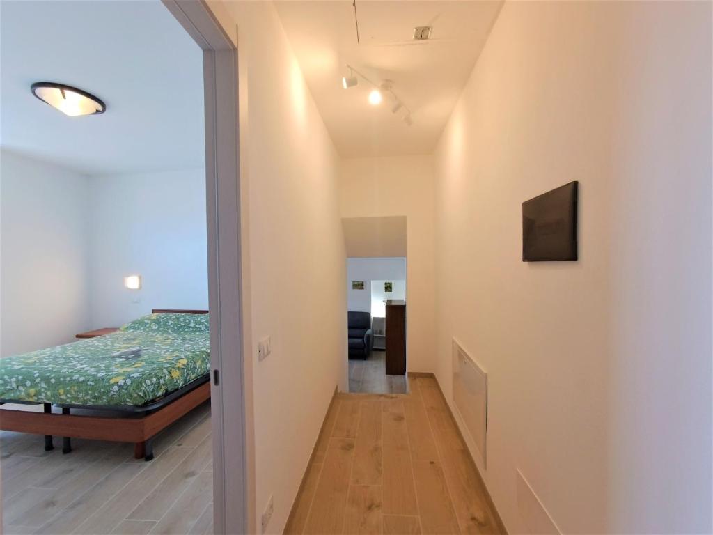 A bed or beds in a room at Appartamento Lella