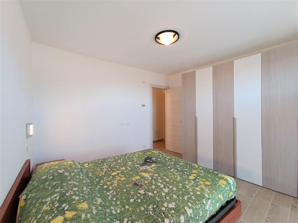 A bed or beds in a room at Appartamento Lella