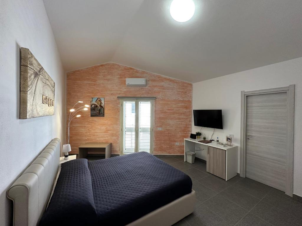 TV a/nebo společenská místnost v ubytování LXR Rooms Carloforte