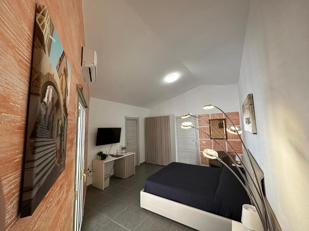 TV a/nebo společenská místnost v ubytování LXR Rooms Carloforte