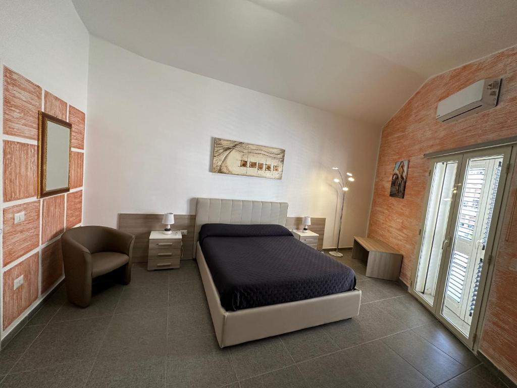 Postel nebo postele na pokoji v ubytování LXR Rooms Carloforte