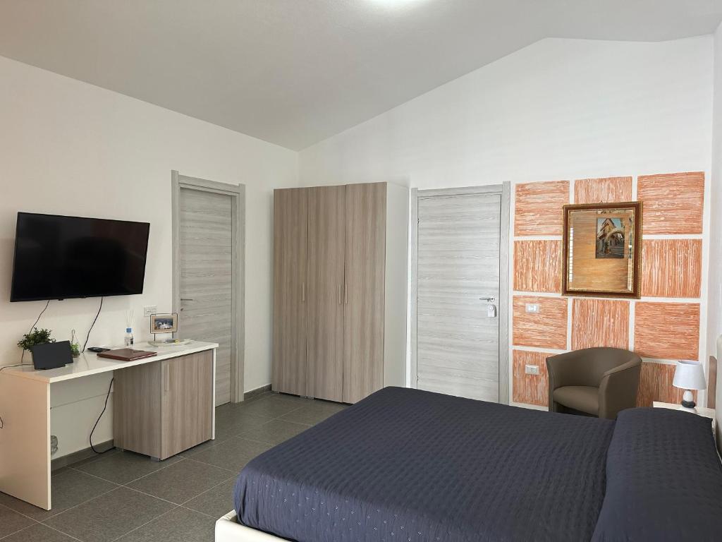 TV a/nebo společenská místnost v ubytování LXR Rooms Carloforte