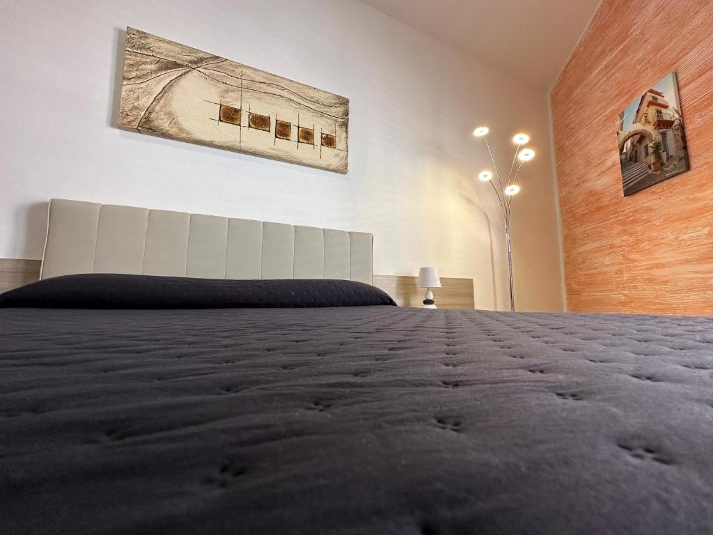 Postel nebo postele na pokoji v ubytování LXR Rooms Carloforte