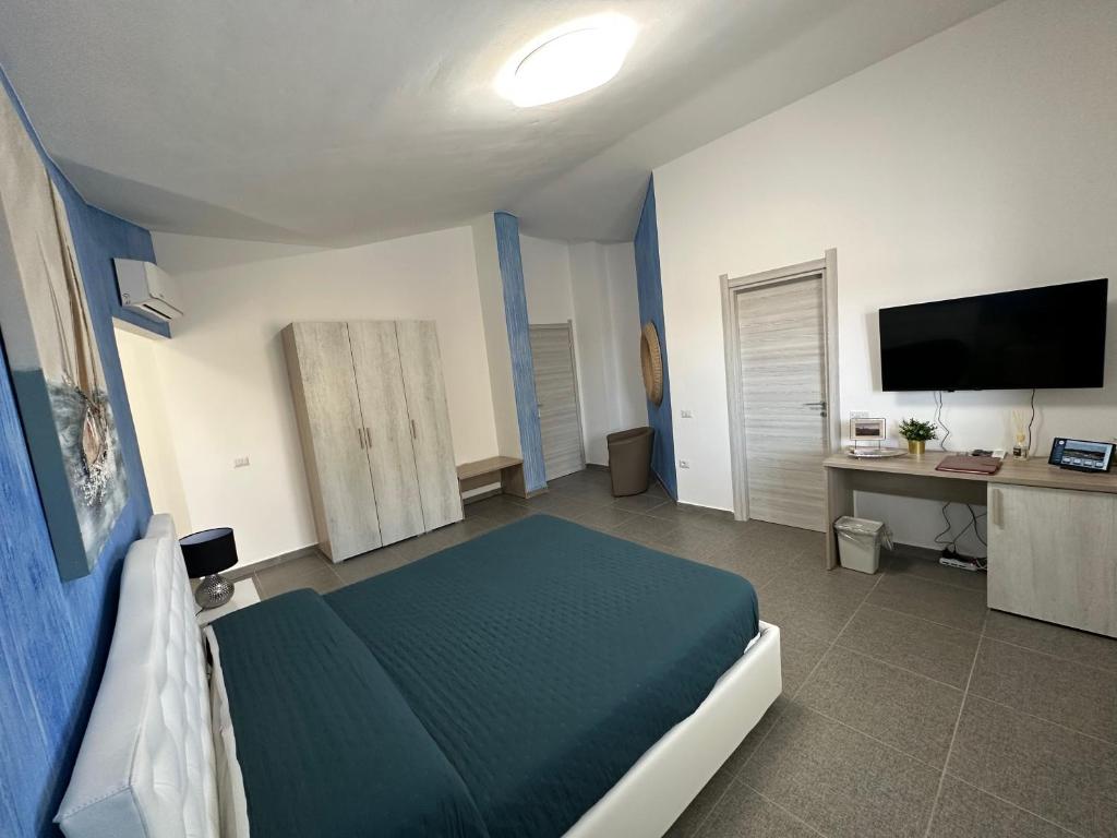 TV a/nebo společenská místnost v ubytování LXR Rooms Carloforte