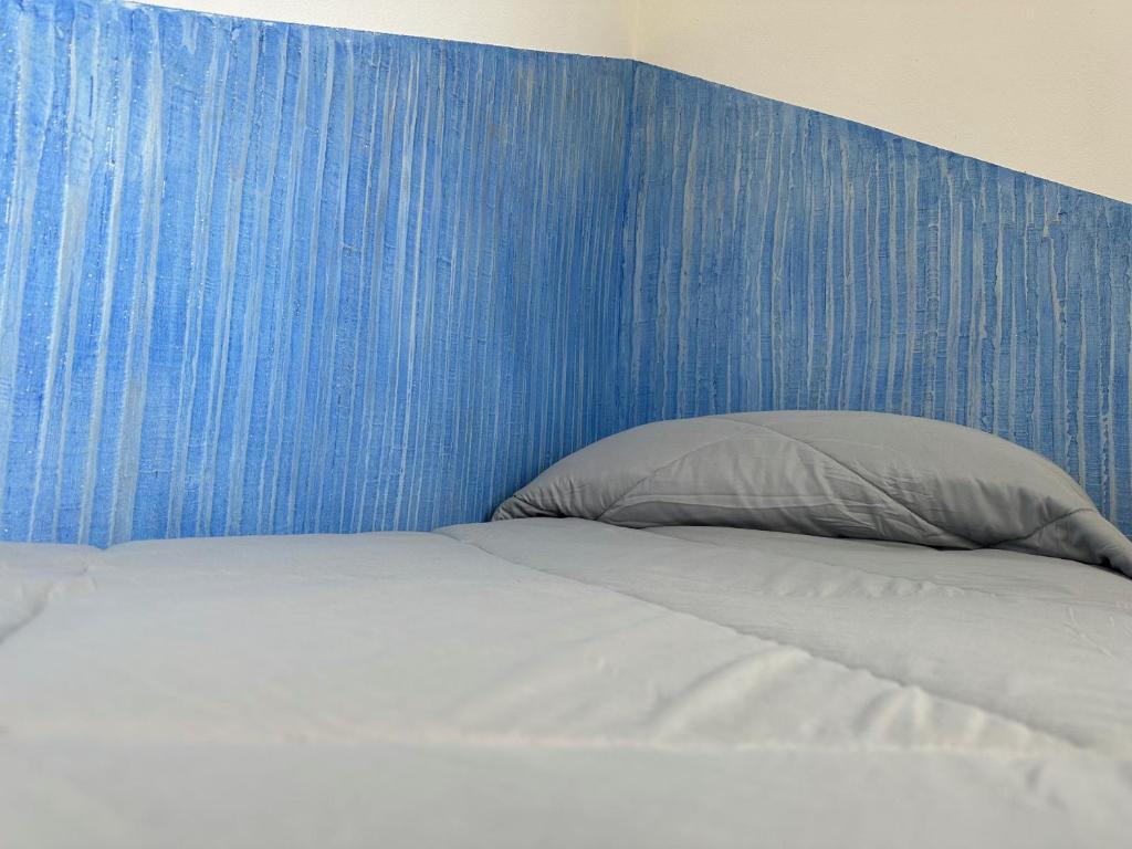 Postel nebo postele na pokoji v ubytování LXR Rooms Carloforte