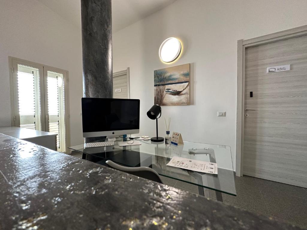 TV a/nebo společenská místnost v ubytování LXR Rooms Carloforte
