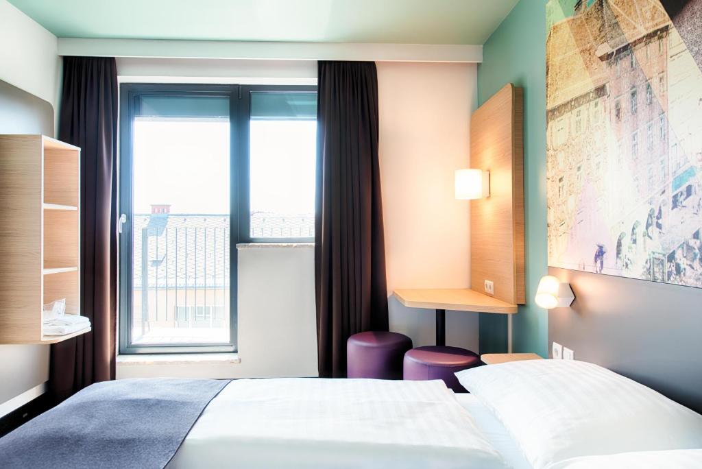 Postel nebo postele na pokoji v ubytování B&B Hotel Graz-Hbf