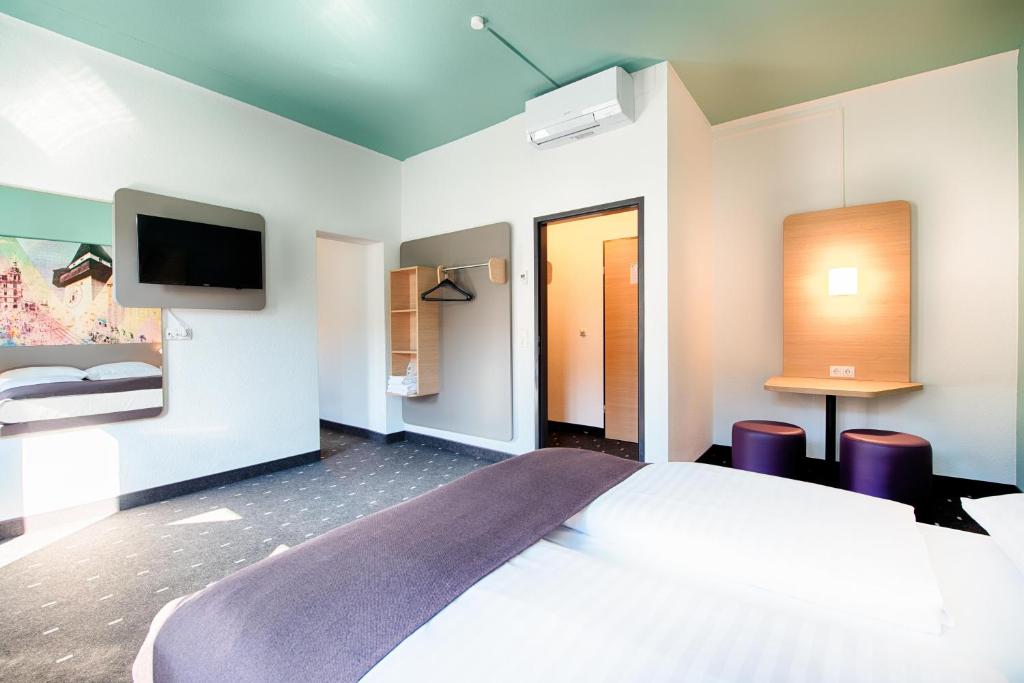 Postel nebo postele na pokoji v ubytování B&B Hotel Graz-Hbf