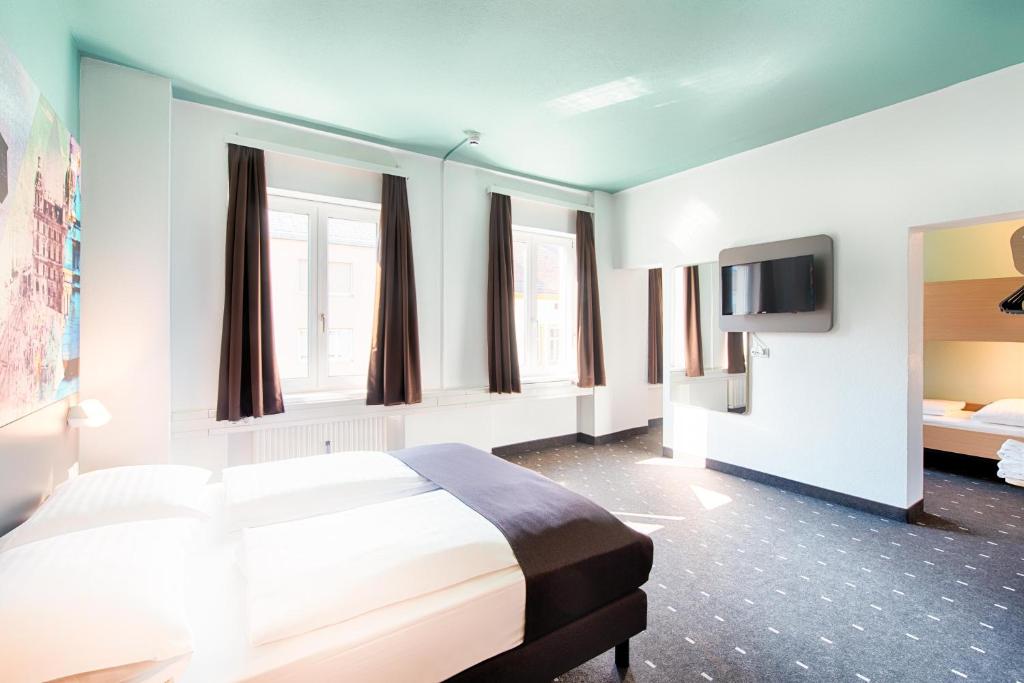 Postel nebo postele na pokoji v ubytování B&B Hotel Graz-Hbf