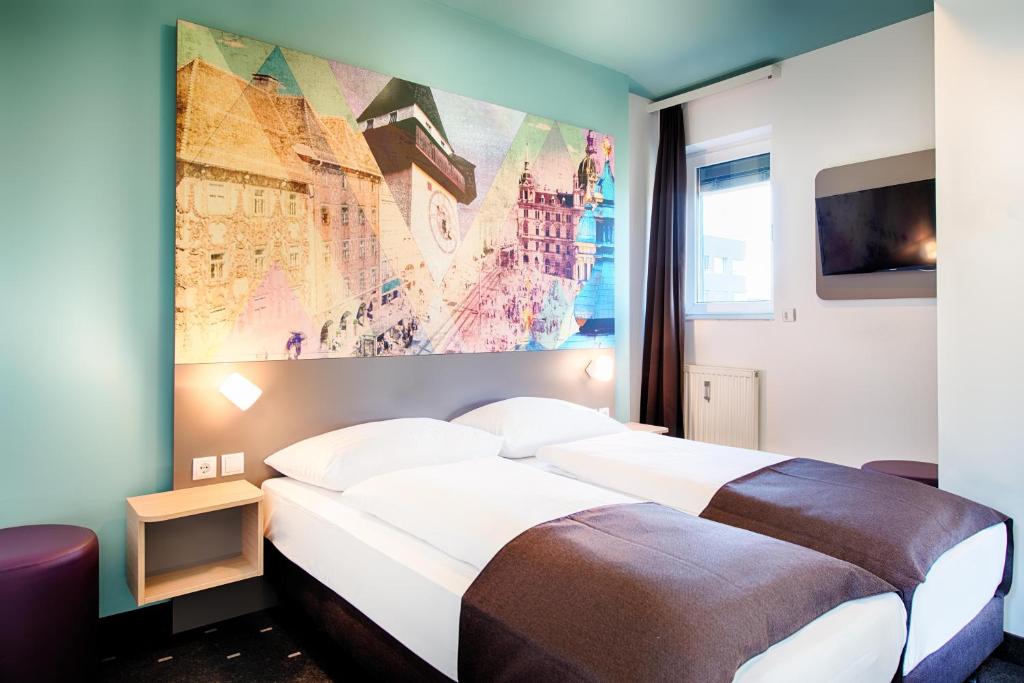 Postel nebo postele na pokoji v ubytování B&B Hotel Graz-Hbf