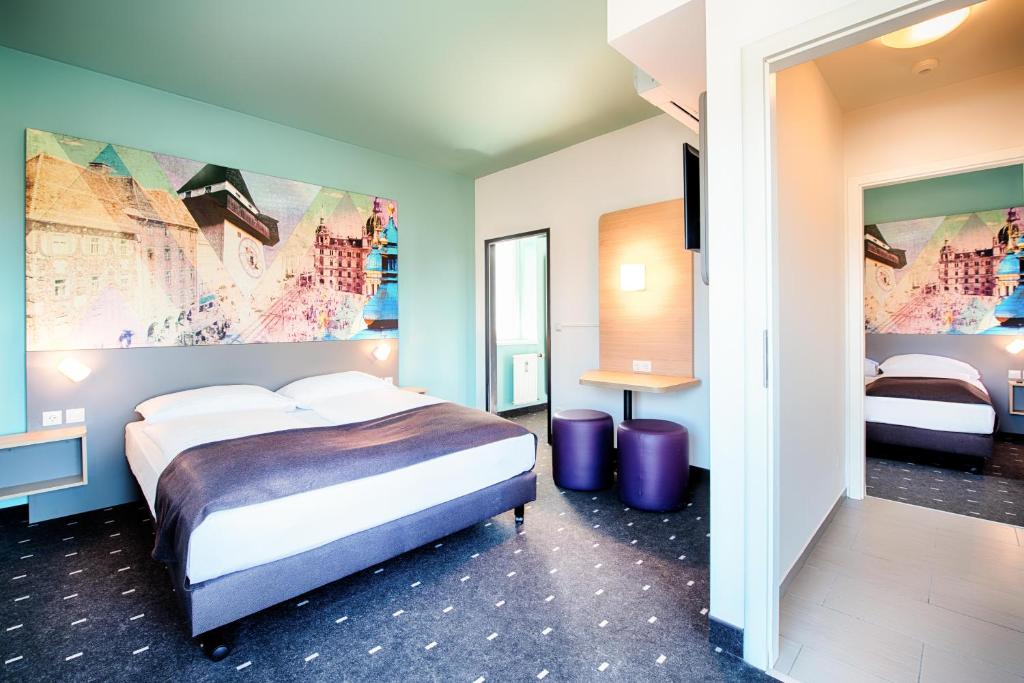 Postel nebo postele na pokoji v ubytování B&B Hotel Graz-Hbf