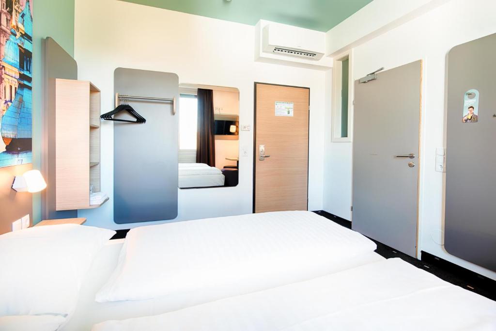 Postel nebo postele na pokoji v ubytování B&B Hotel Graz-Hbf