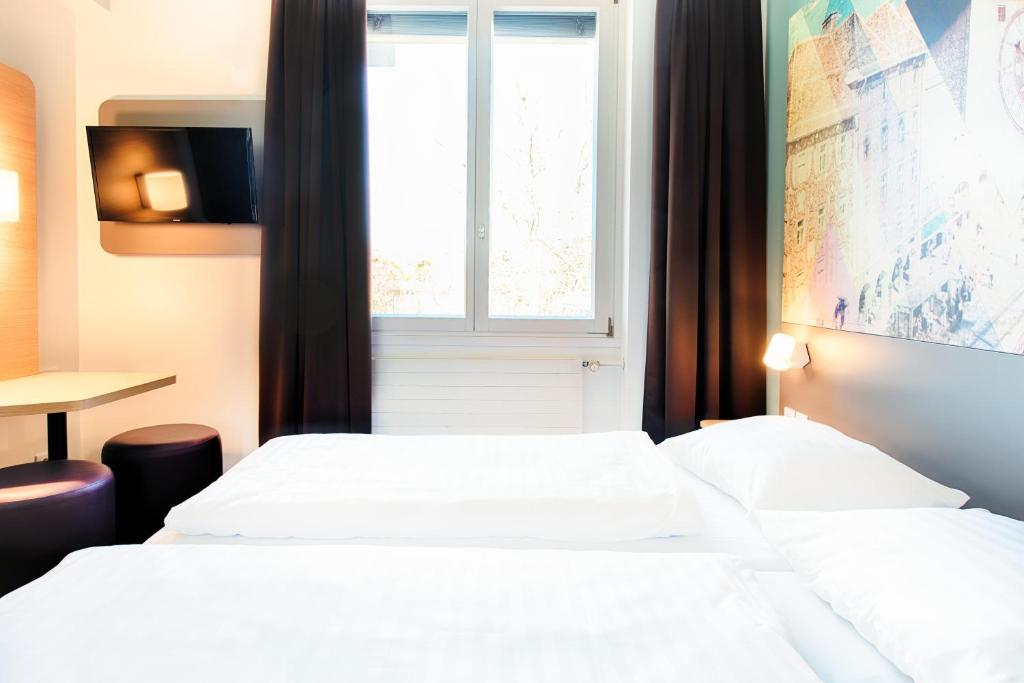Postel nebo postele na pokoji v ubytování B&B Hotel Graz-Hbf