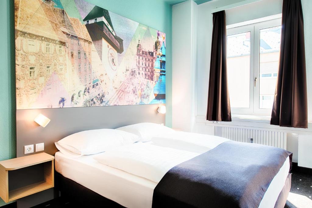 Postel nebo postele na pokoji v ubytování B&B Hotel Graz-Hbf
