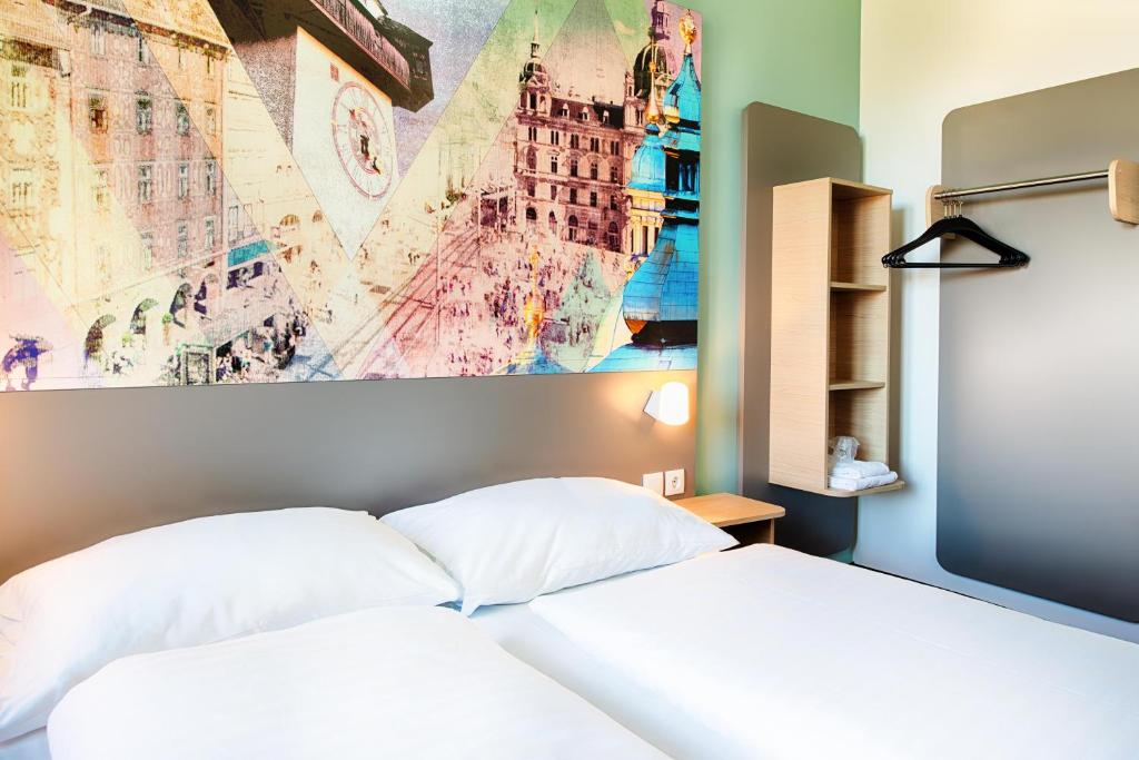 Postel nebo postele na pokoji v ubytování B&B Hotel Graz-Hbf