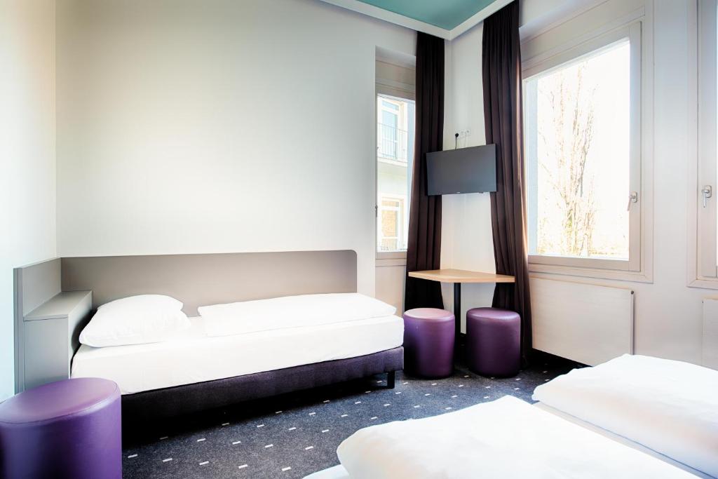 Postel nebo postele na pokoji v ubytování B&B Hotel Graz-Hbf