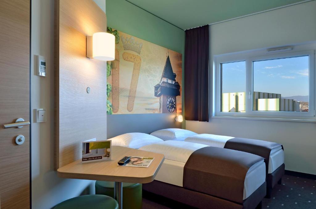 Uma cama ou camas num quarto em B&B Hotel Graz City-Süd