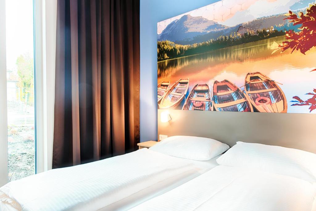 Postel nebo postele na pokoji v ubytování B&B Hotel Kempten