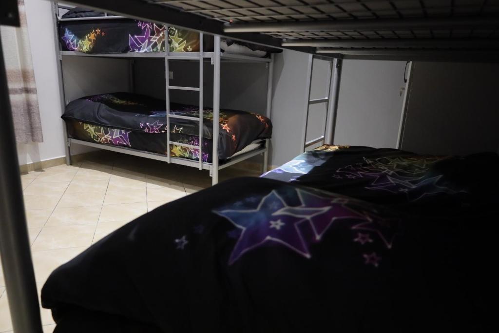 Postel nebo postele na pokoji v ubytování Sonche Hostel
