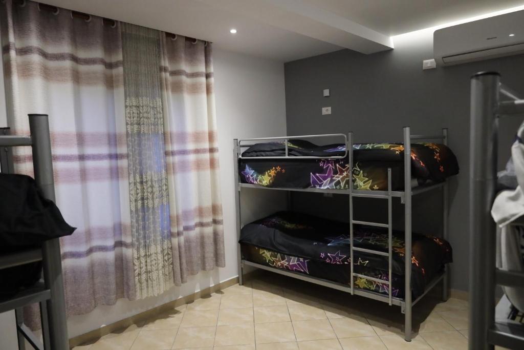 Postel nebo postele na pokoji v ubytování Sonche Hostel