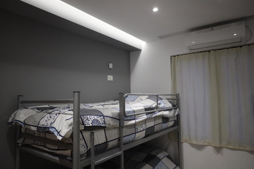 Postel nebo postele na pokoji v ubytování Sonche Hostel