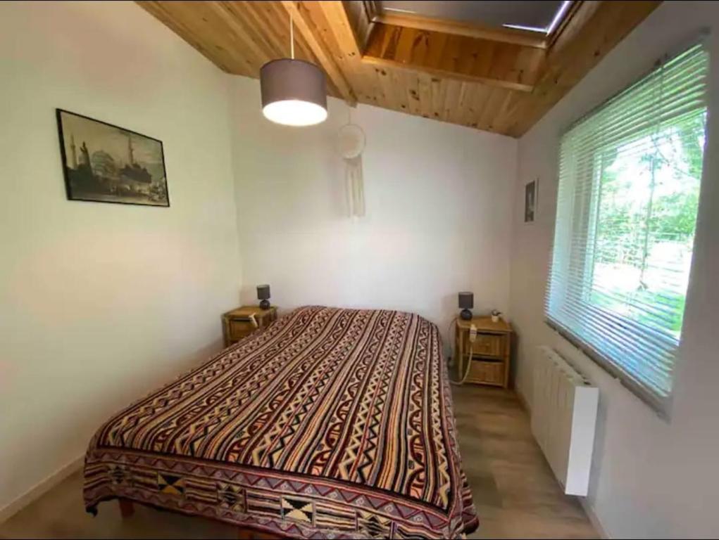 Ένα ή περισσότερα κρεβάτια σε δωμάτιο στο Chambre d hotes