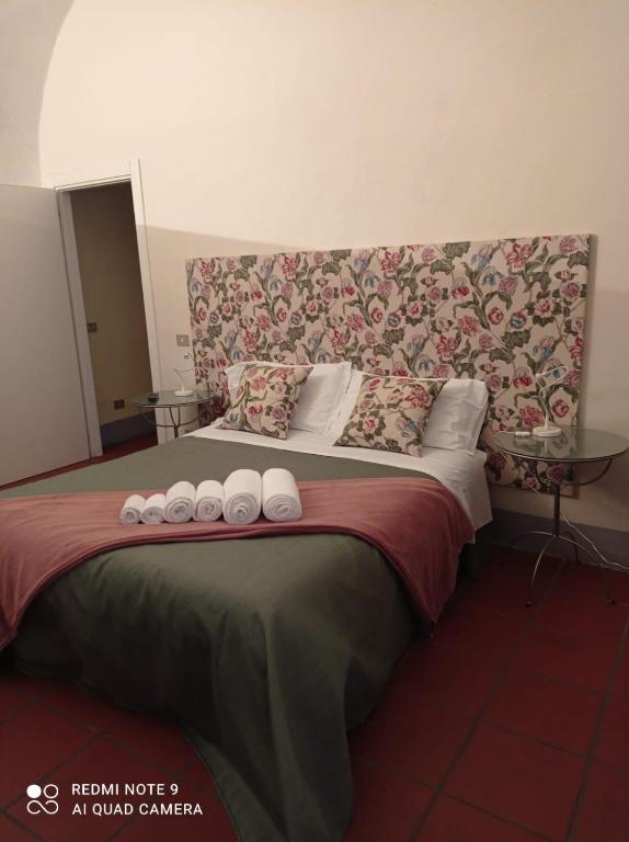 Postel nebo postele na pokoji v ubytování Luisa in Palazzo Bianchi