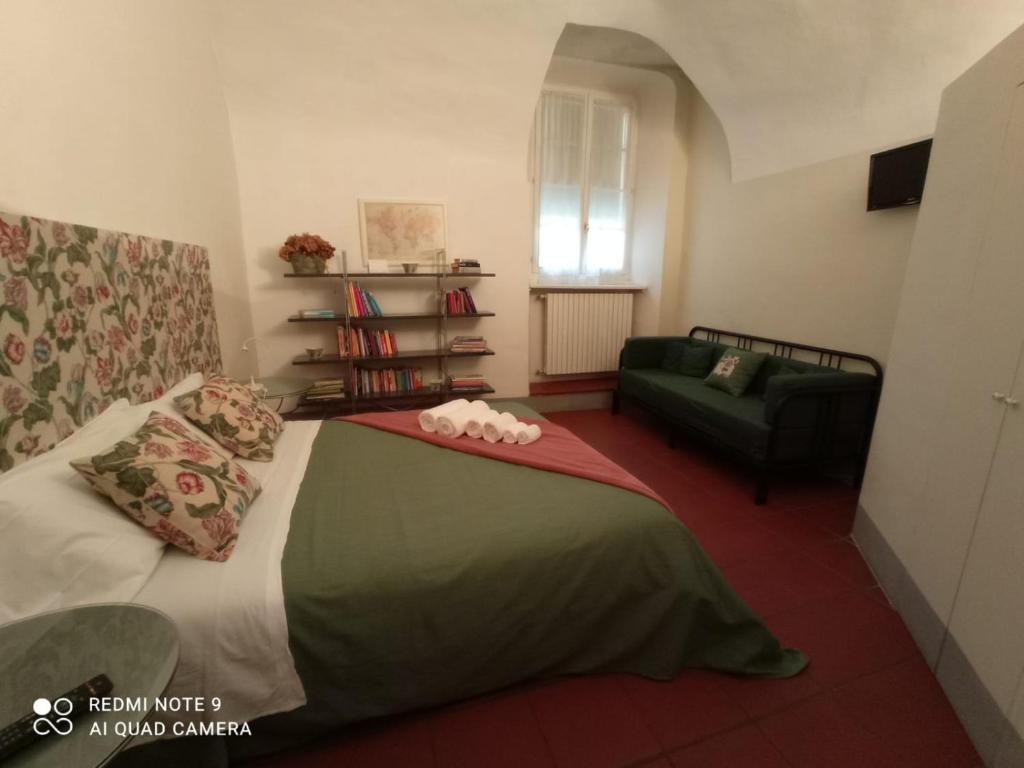 Postel nebo postele na pokoji v ubytování Luisa in Palazzo Bianchi