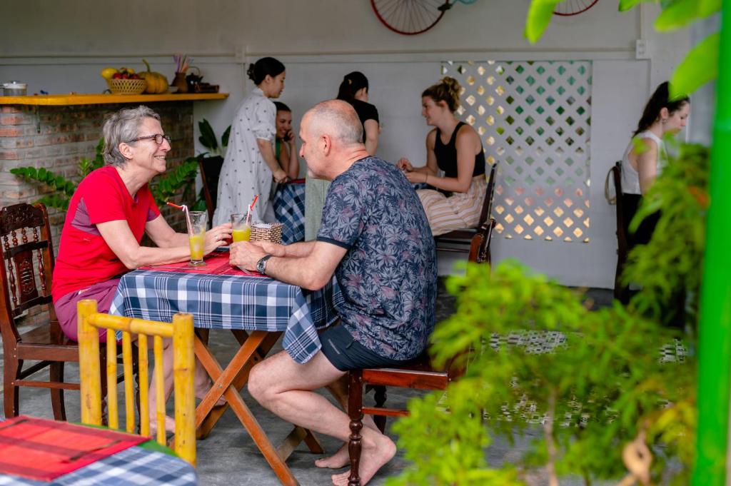 a group of people sitting at a table at 5 Coconut Villa in Hoi An