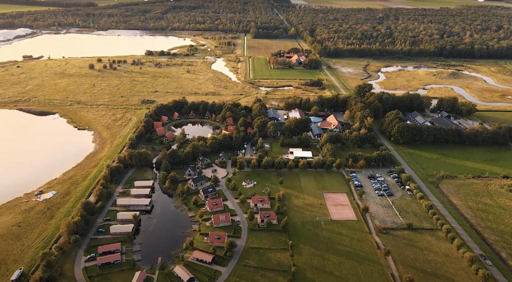 an aerial view of a village next to a lake at Vakantiepark Eigen Wijze in Bant