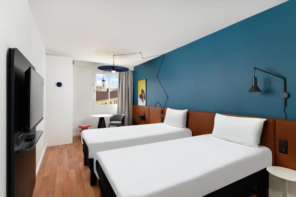 Postel nebo postele na pokoji v ubytování Ibis Budapest Centrum