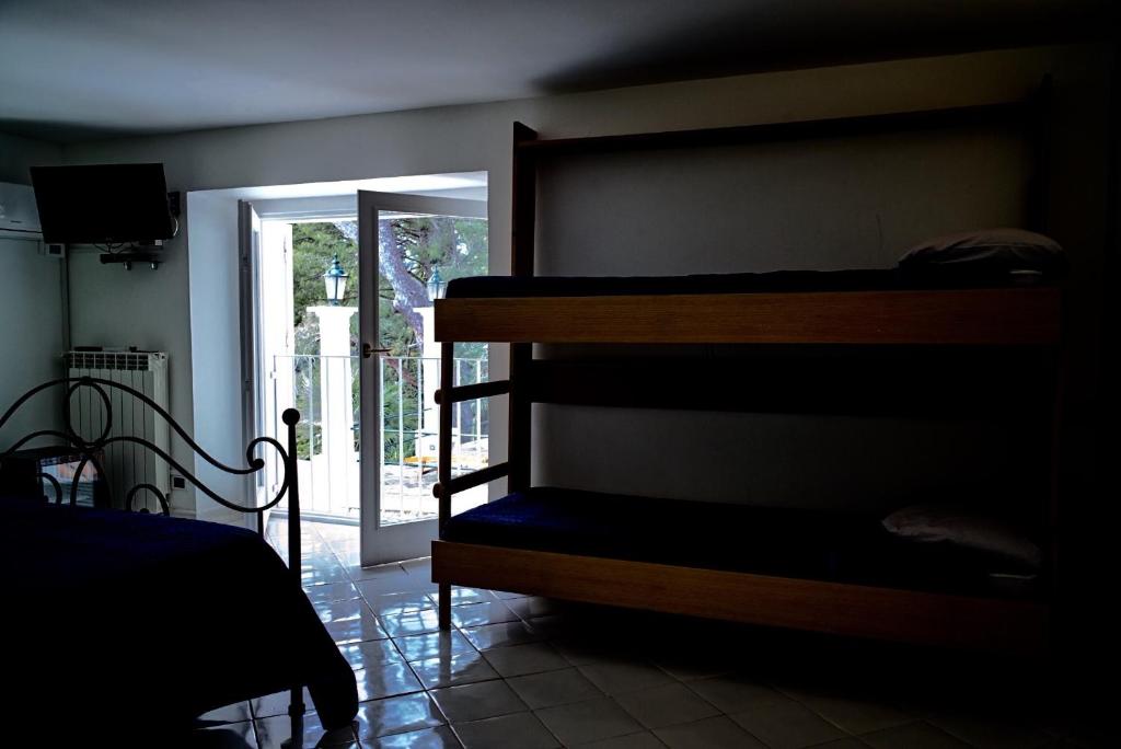 Postel nebo postele na pokoji v ubytování Villacore Capri
