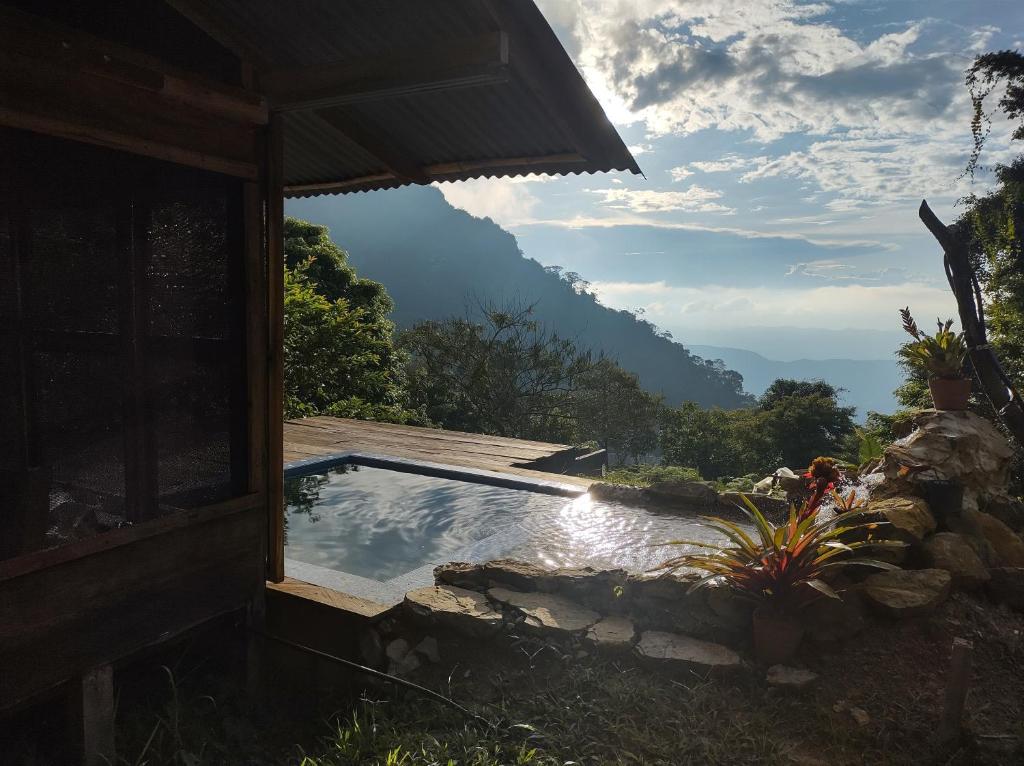 a swimming pool with a view of a mountain at Monte La MaMa Eco Lodge in Viotá