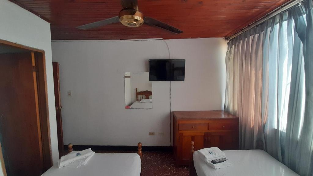 Postel nebo postele na pokoji v ubytování HOTEL en MONTERIA CITY