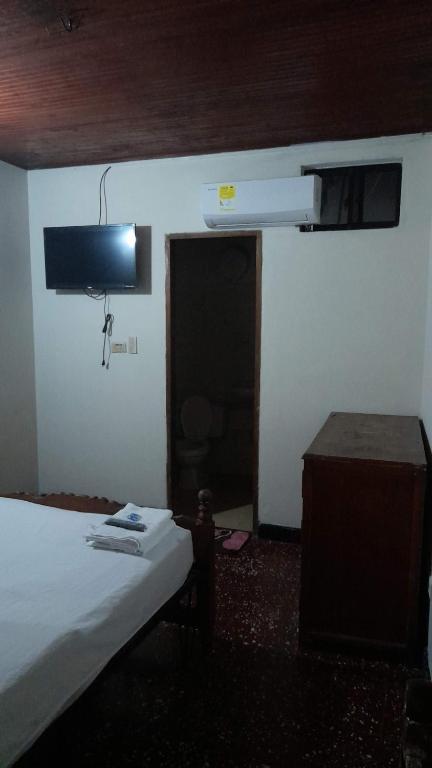 Postel nebo postele na pokoji v ubytování HOTEL en MONTERIA CITY
