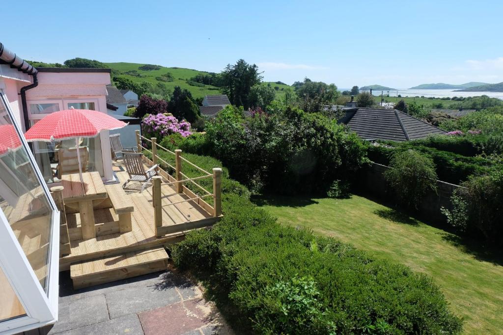 a view of a garden from a house at Tir Nan Og in Rockcliffe