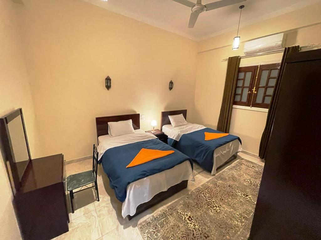 Postel nebo postele na pokoji v ubytování Happiness Guest House