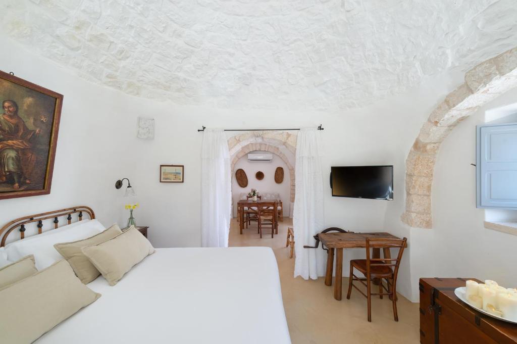 Postel nebo postele na pokoji v ubytování Agriturismo Masseria Aprile