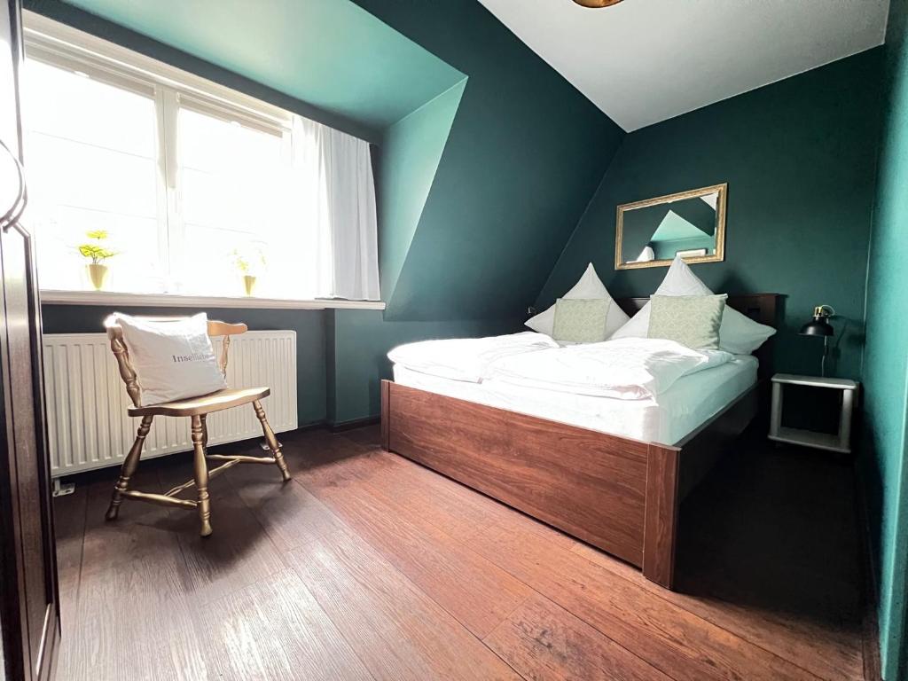 Un pat sau paturi într-o cameră la Strandmuschel