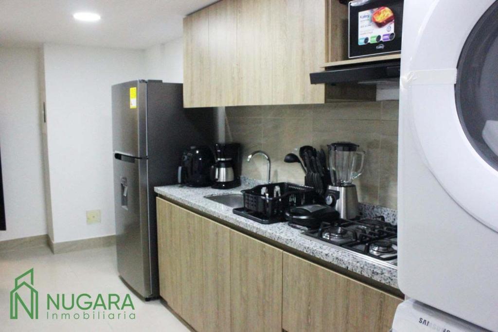Kuchyň nebo kuchyňský kout v ubytování Apartamento Super-Confortable