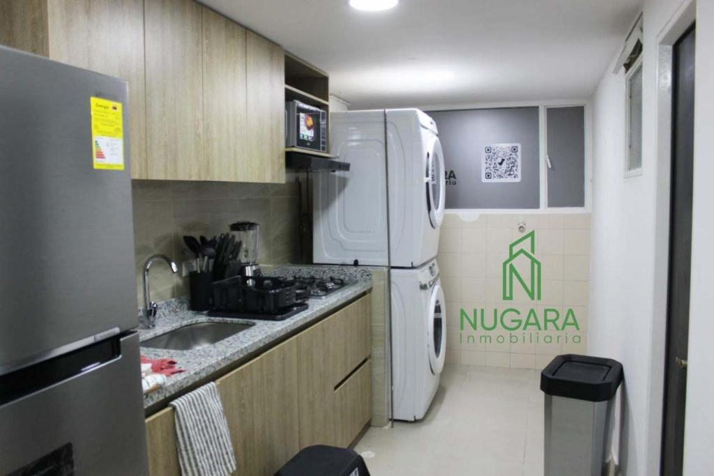 Kuchyň nebo kuchyňský kout v ubytování Apartamento Super-Confortable