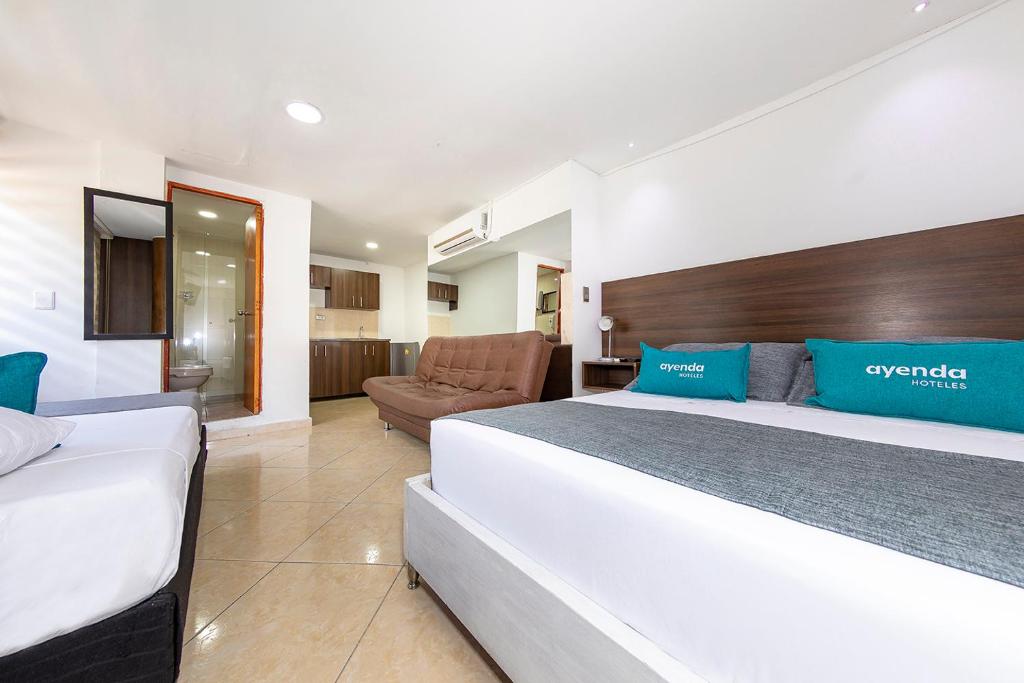 Postel nebo postele na pokoji v ubytování Hotel Ayenda Palo Alto